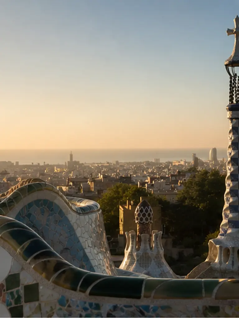 Park Güell mosaic terrace at golden hour, quiet-luxury Barcelona proposal atmosphere