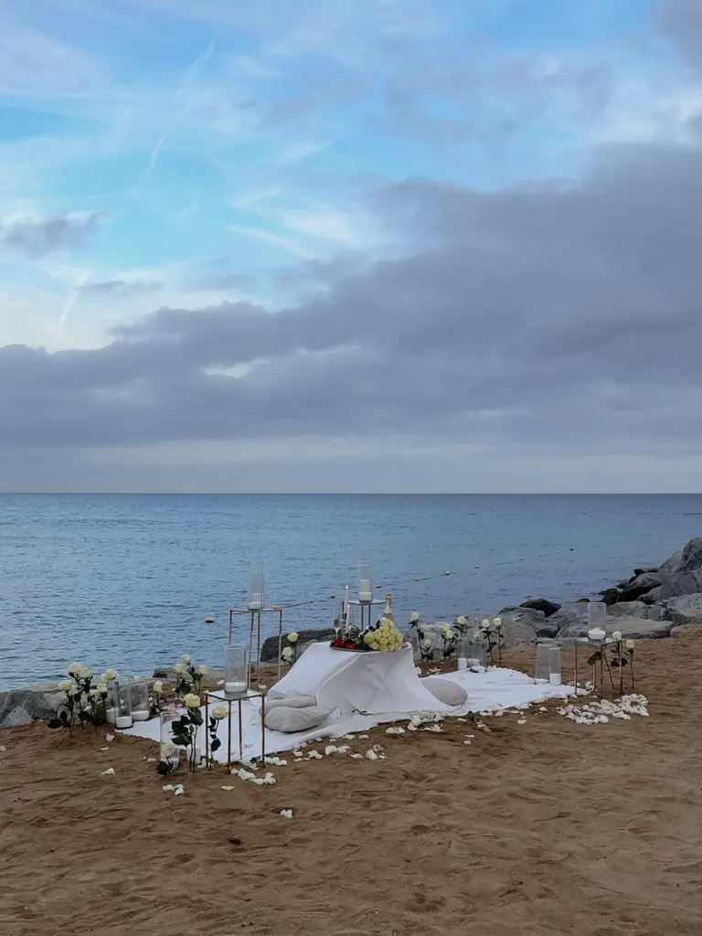 Nova Mar Bella beach proposal setup in Barcelona showing picnic decor - view 1